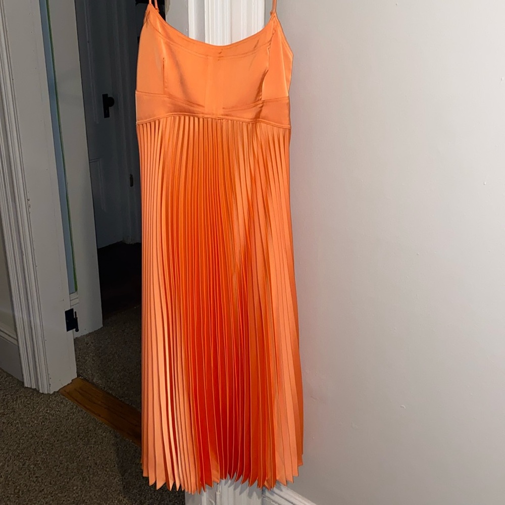 Neon orange pleated midi adjustable strap dress with open back